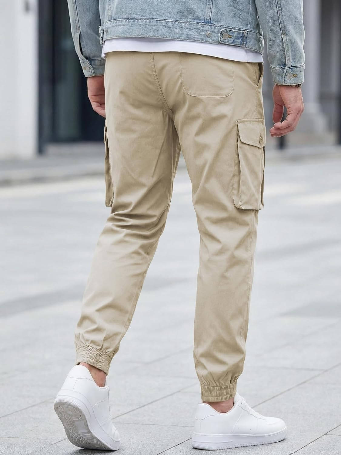 Homixa Belvora men's cargo joggers with drawstring waist, flap pockets, and tapered cuffs, shown in a casual fit.