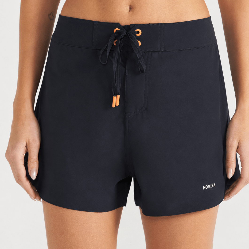Black Homixa Wave women's boardshorts with a relaxed fit and wave pattern, ideal for beach or swimwear occasions.