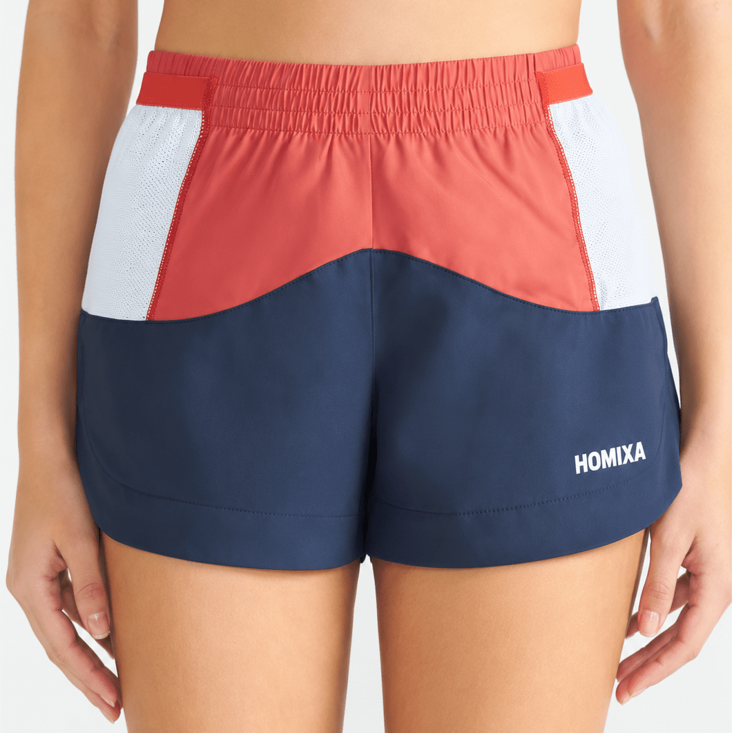 Homixa Sprint color block women's shorts in navy blue and coral, featuring a stylish and comfortable design.