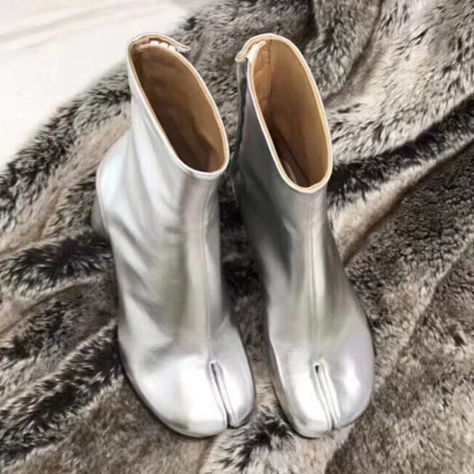 Homixa women's ankle boots from the Maya Edit featuring stylish black leather with a low heel and side zipper detail.