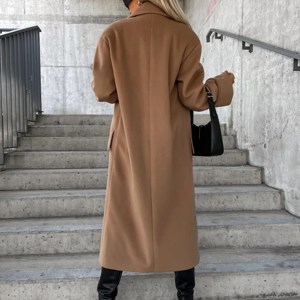 Women’s trench coat by Homixa featuring classic design, belted waist, and neutral color, perfect for layering and stylish outerwear.