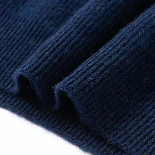 Jack Hafford Highland Wool Sweater in earthy tones, featuring a cozy knit pattern and ribbed cuffs and hem.