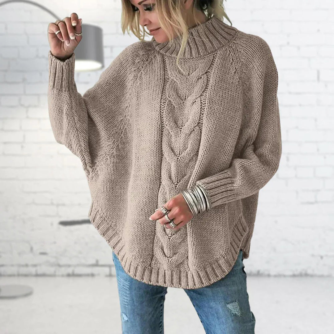Women’s chunky knit sweater by Homixa, long-length style in cozy, textured wool yarn ideal for fall and winter wear.