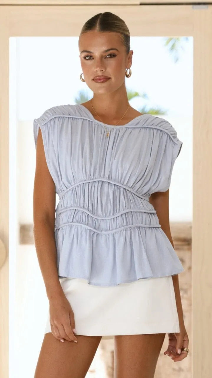 Homixa women's ruched cap-sleeve peplum blouse with fitted waist and elegant design, shown on a model.