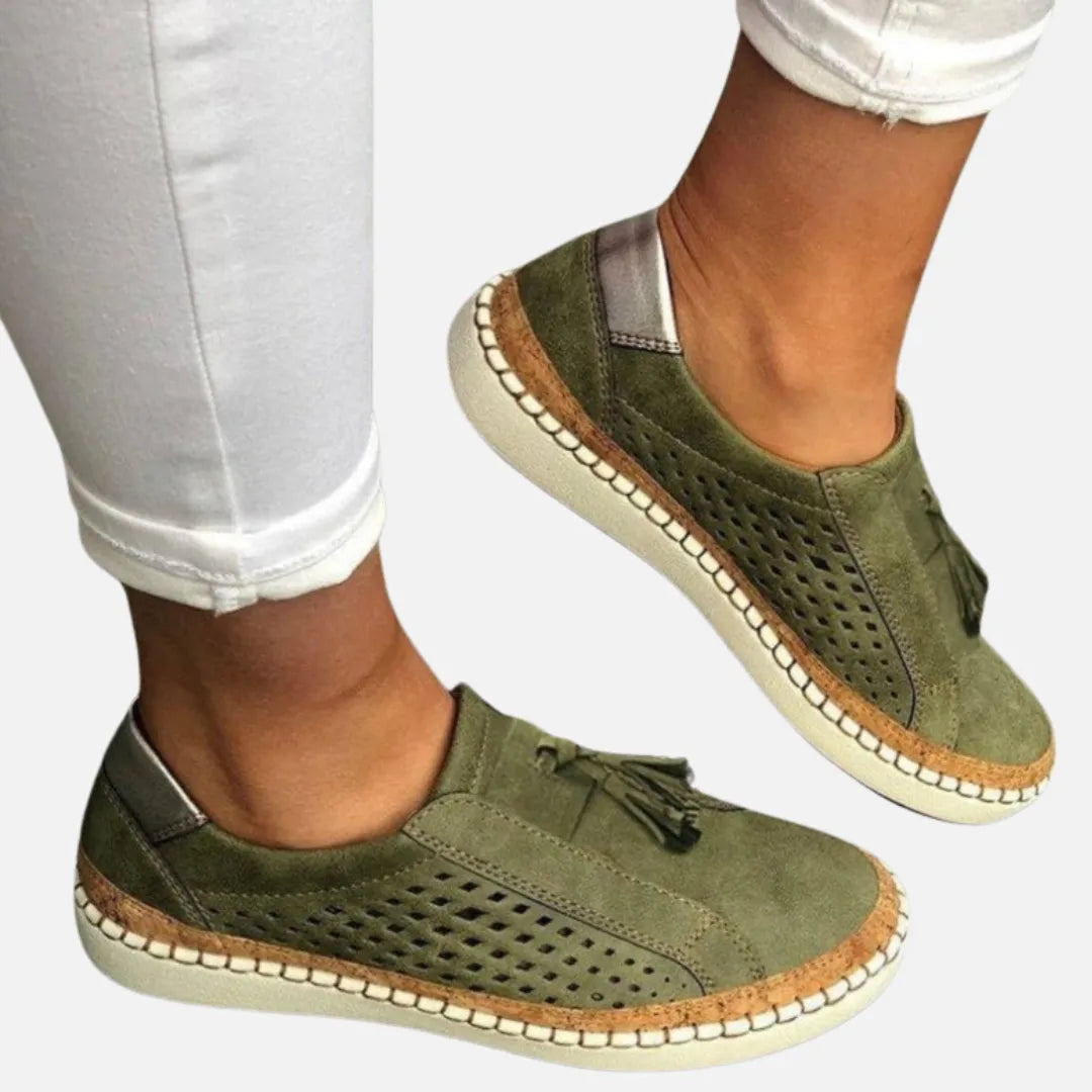 Homixa Women's perforated tassel slip-on shoes with stylish cutouts and tassel detail, perfect for casual wear.