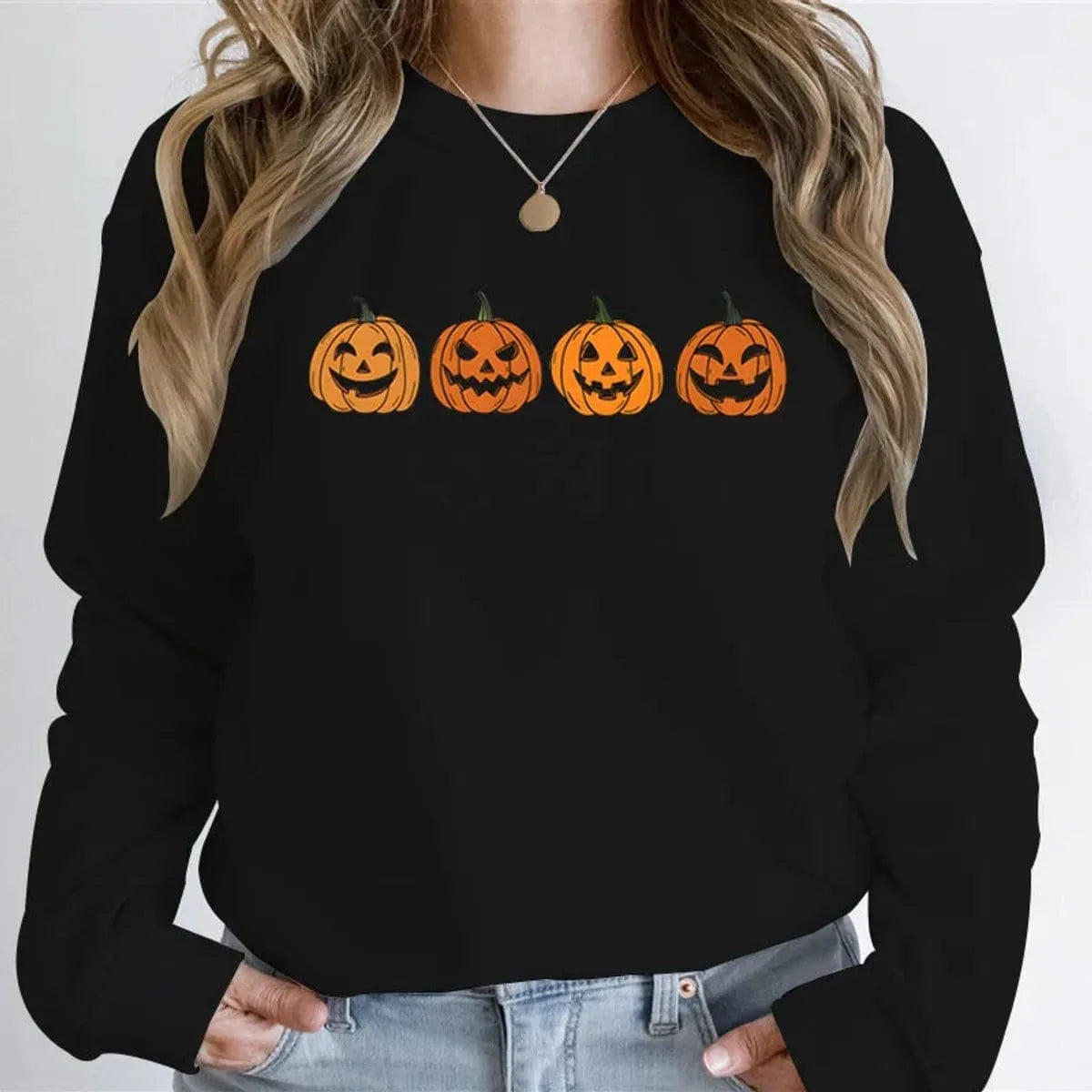 Women's Halloween sweatshirt by Homixa featuring a festive Jack-o-Lantern graphic on a cozy crewneck sweatshirt.