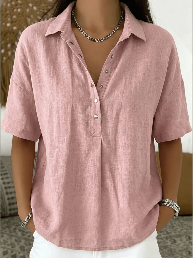 Homixa Avery women's relaxed collared shirt, light fabric, with a classic collar and button front, displayed on a hanger.