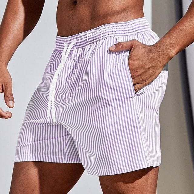 Homixa Kai men's drawstring swim shorts with a vibrant pattern, lightweight fabric, and adjustable waistband for beach or pool use.