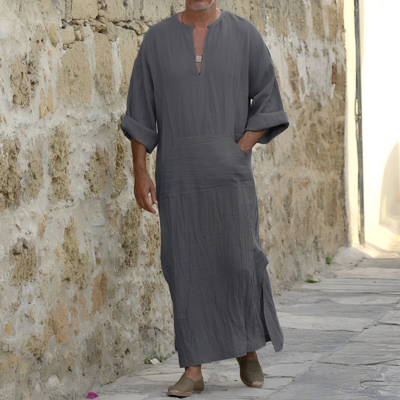 Men's minimalist shirt dress with side slit, long sleeves, styled by Mainz-Mode, casual and modern men's tops and blouses.