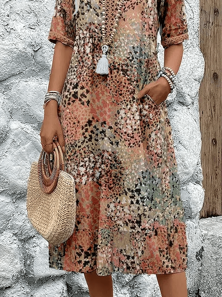 Homixa Sienna women's printed midi dress with floral pattern, flowing fabric, and V-neck design, perfect for summer wear.