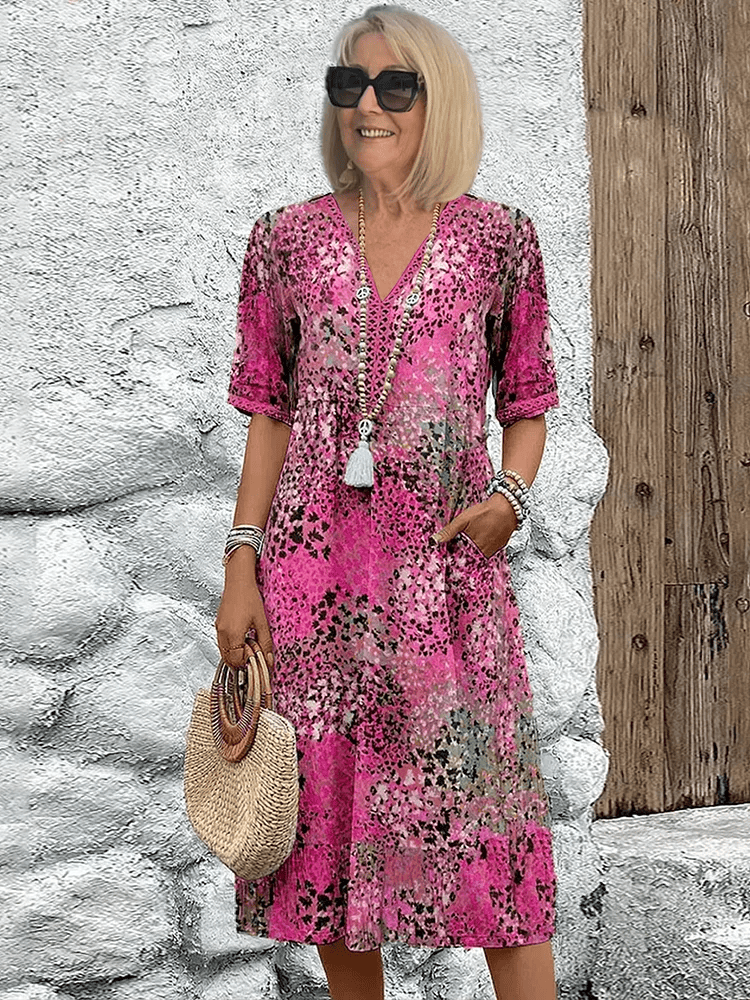 Homixa Sienna women's printed midi dress featuring a vibrant floral pattern and flowing fabric, perfect for casual or dressy occasions.