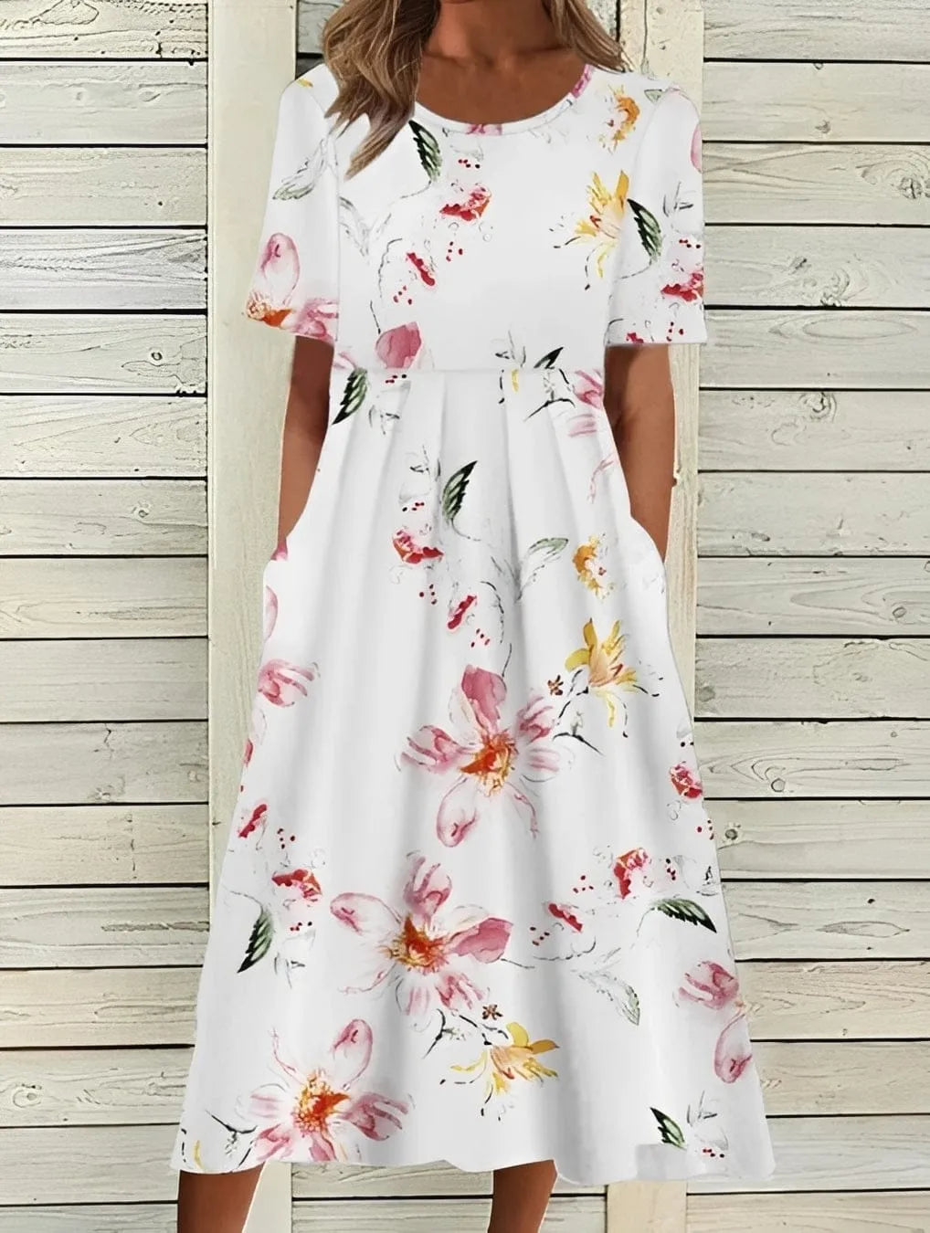 Homixa Women's floral short-sleeve maxi dress displayed on a hanger, featuring a vibrant floral pattern and flowing fabric.