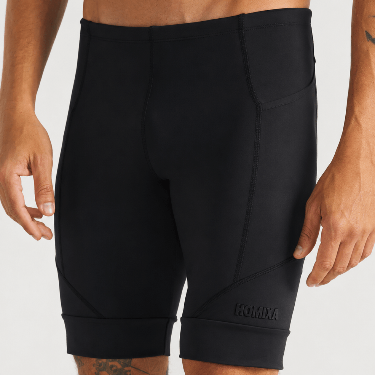 Black Homixa Tech Pro men's compression shorts shown in a close-up, highlighting the sleek fabric and fit.