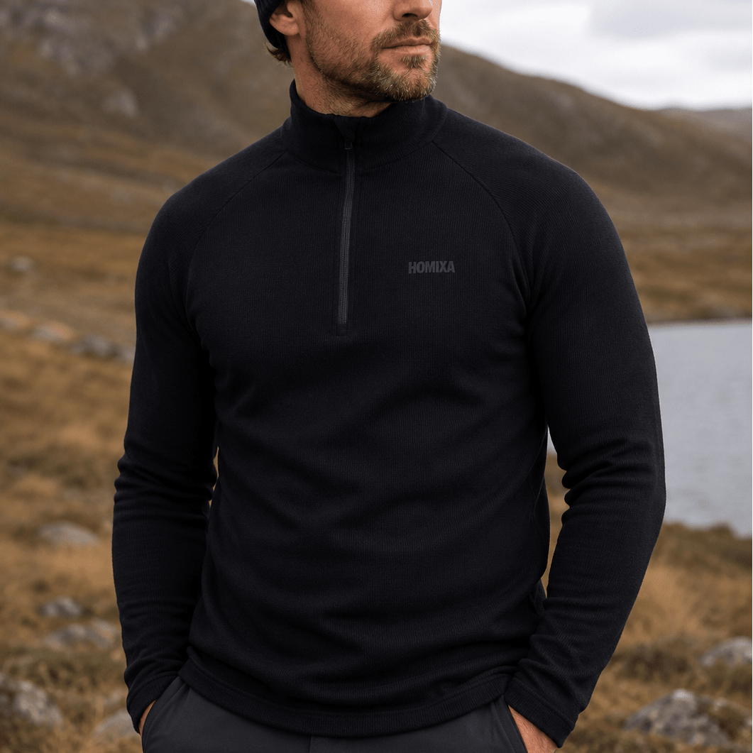 Black Homixa men's thermal half-zip jacket displayed, featuring a sleek design and comfortable fit for cold weather.