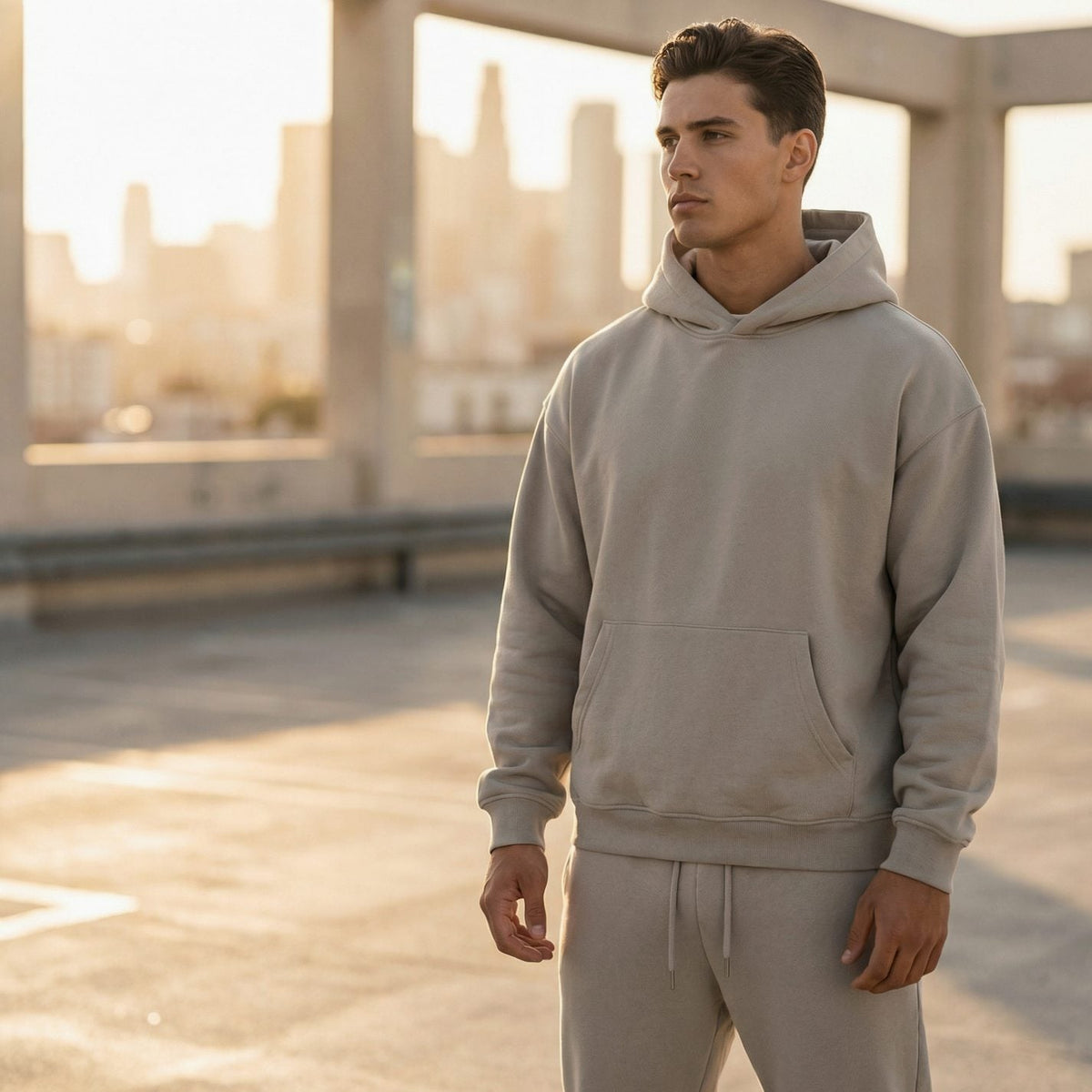 Men's oversized fleece tracksuit set by Homixa featuring a drawstring hoodie and elastic-waist joggers, shown in a relaxed fit.