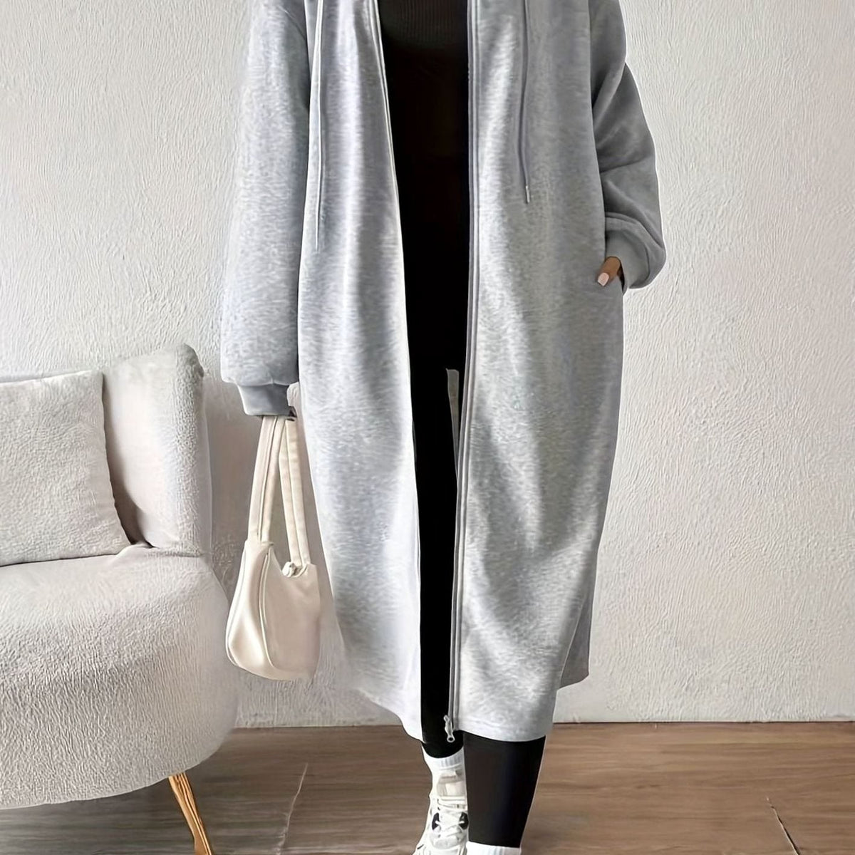 Women's oversized hooded zip front winter coat by Homixa with side pockets, long casual design, and cozy warm fit.