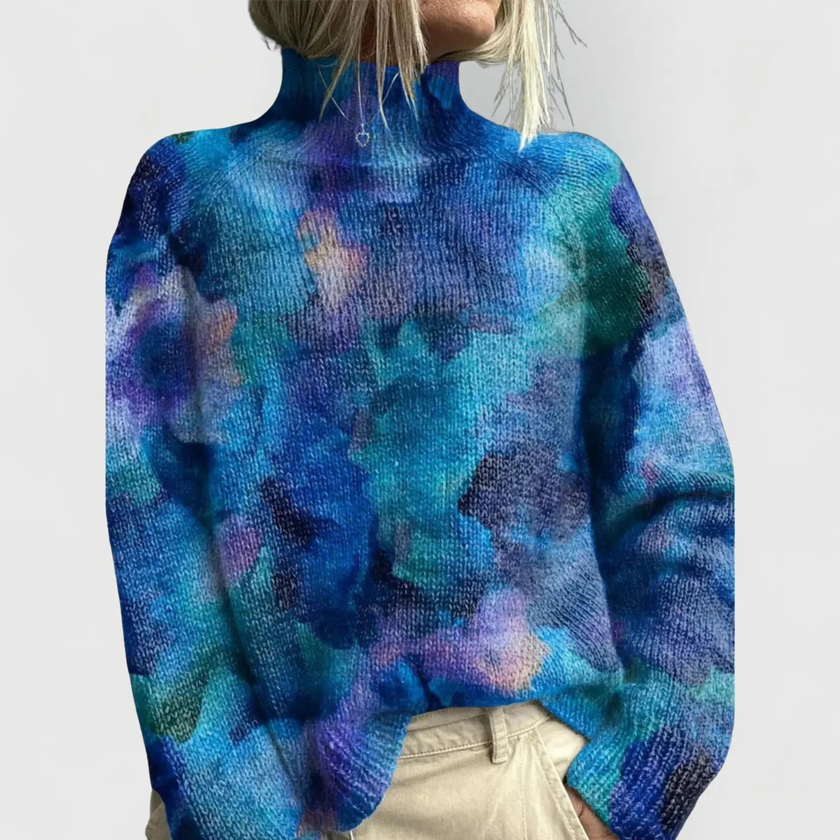 Women's printed long-sleeve turtleneck sweater by Homixa with a softly structured silhouette and colorful pattern.