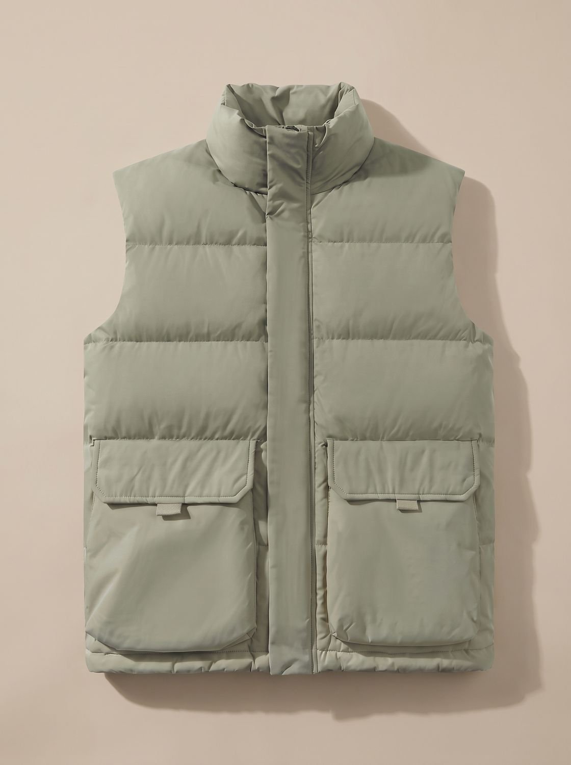 Women's Homixa quilted stand-collar puffer vest with flap pockets and hidden zip, stylish and warm outerwear.