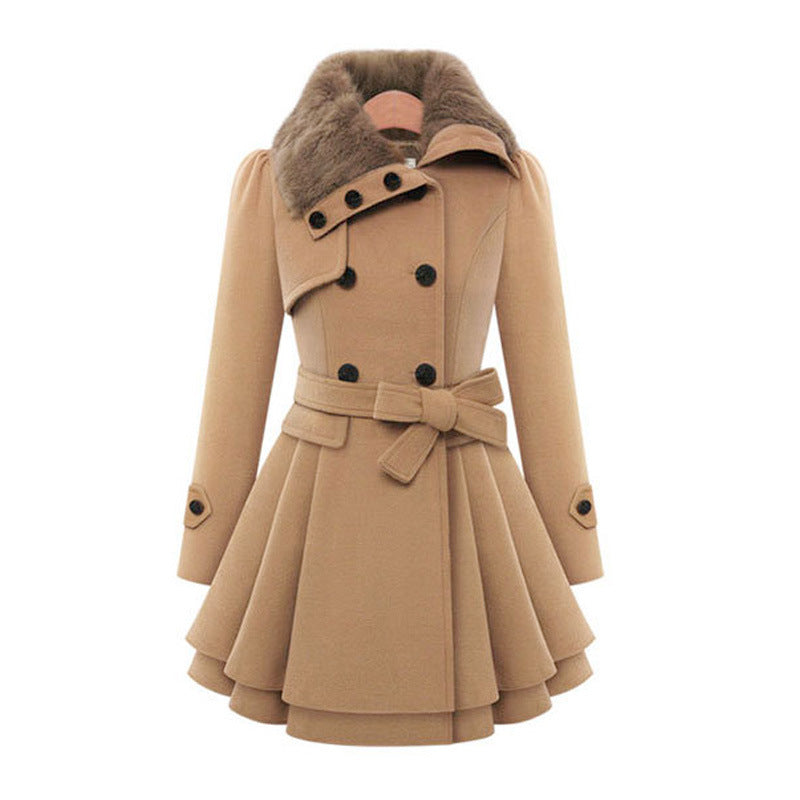 A woman wearing the Claudia vintage flair trench coat by Avery Lane Brighton, stylish women's coat with classic design and belted waist.