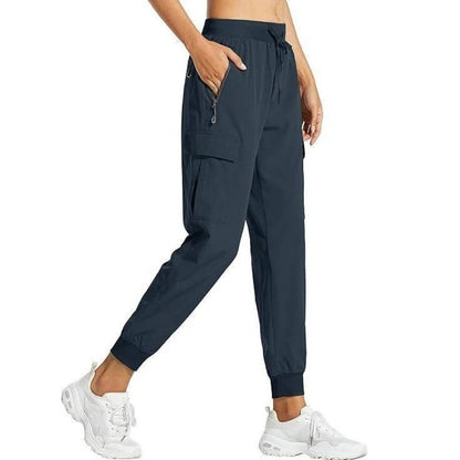 Women's Olive & Evy cargo joggers, lightweight quick-dry hiking pants with a relaxed fit and multiple pockets for casual or travel wear.
