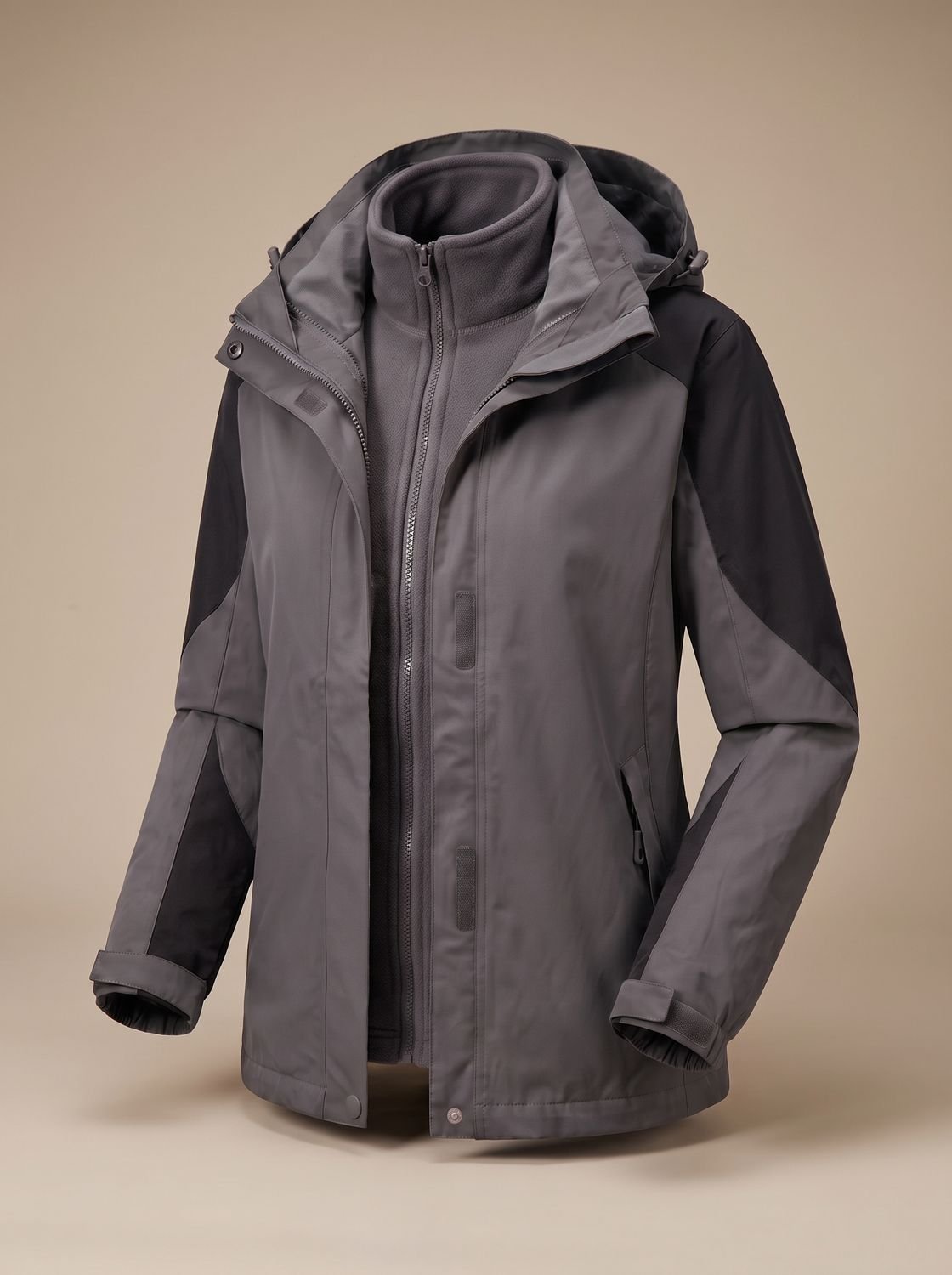 Homixa 2-in-1 fleece softshell jacket with removable liner and adjustable hood, shown in a versatile outdoor style.