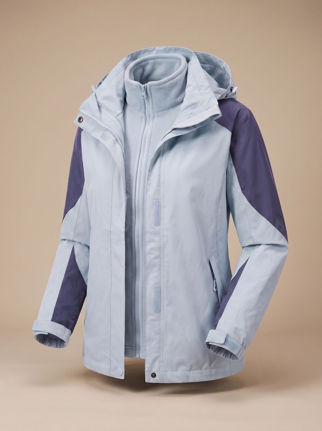 Homixa 2-in-1 fleece softshell jacket with removable liner, adjustable hood, and zippered pockets, designed for versatile outdoor wear.