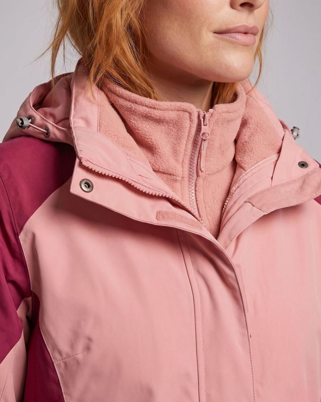 Homixa 2-in-1 hooded water-resistant softshell jacket with removable fleece inner layer, shown hanging with zipped outer and inner layers.
