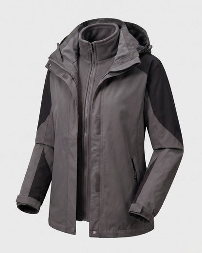 Homixa 2-in-1 polyester softshell jacket with detachable fleece inner layer and hood, shown with front view and adjustable cuffs.