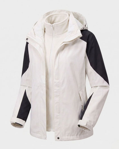 Homixa 2-in-1 polyester softshell jacket with detachable fleece inner layer, hood, and adjustable cuffs, suitable for outdoor wear.