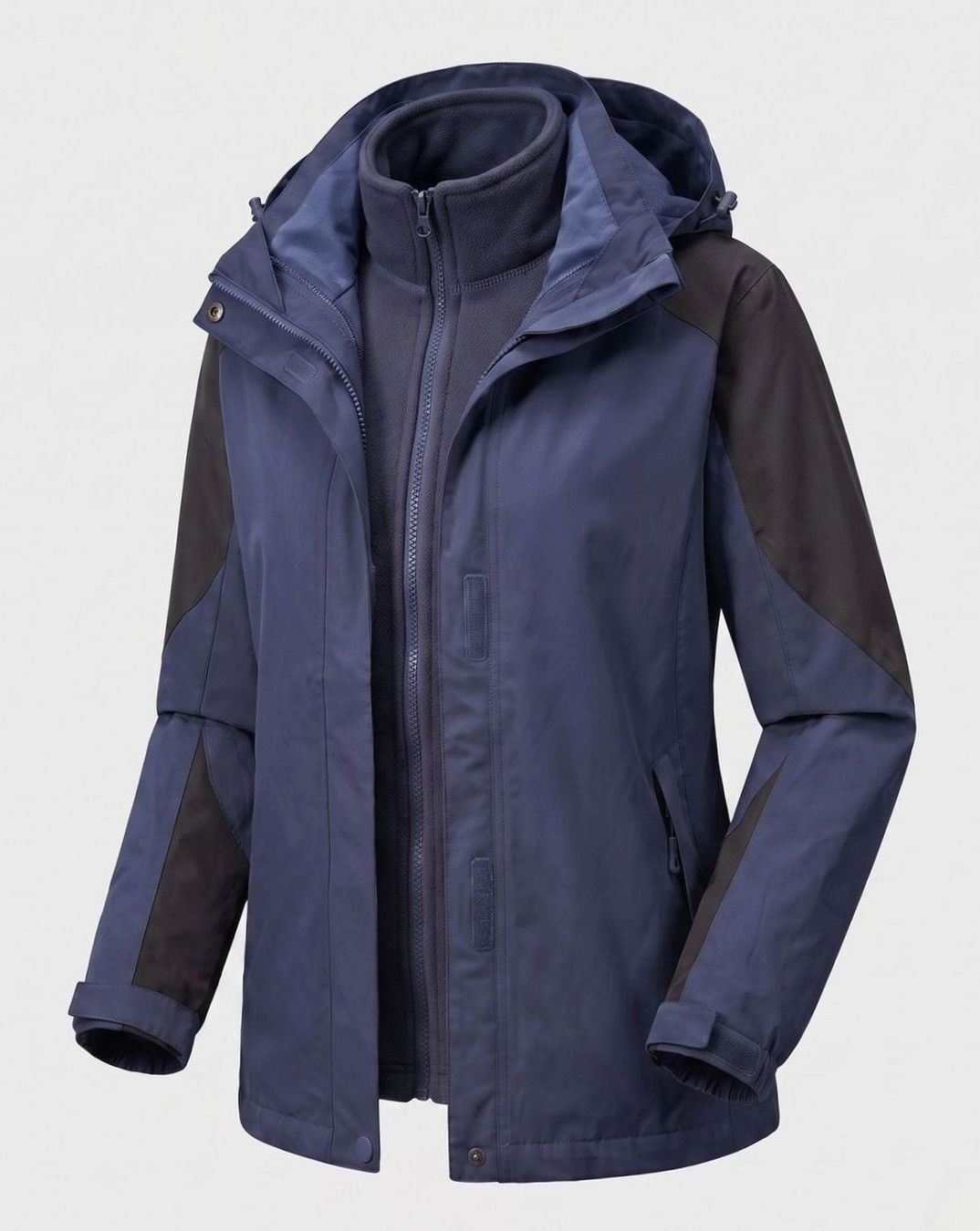 Homixa 2-in-1 polyester softshell jacket with detachable fleece inner layer, hood, and adjustable cuffs, suitable for outdoor wear.
