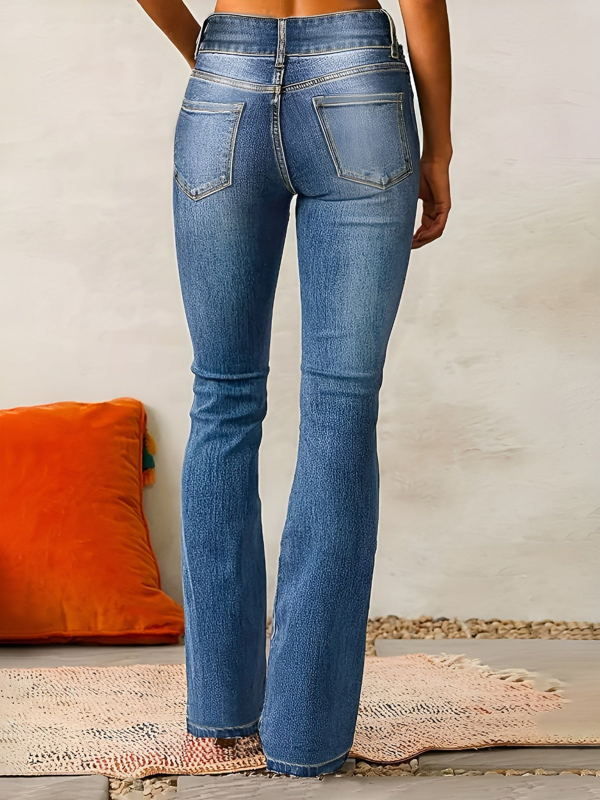 Homixa Alana comfortable flared jeans with double-button waist, washed finish, and contrast stitching, displayed on a model.