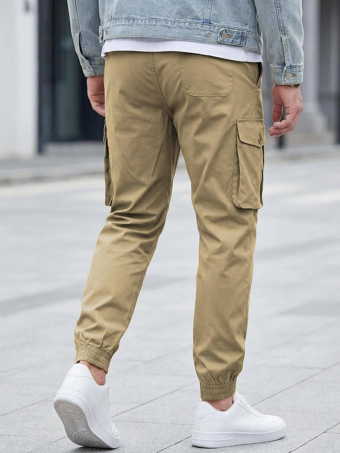Homixa Belvora men's cargo joggers with drawstring waist, flap pockets, and tapered cuffs, made of comfortable durable fabric.