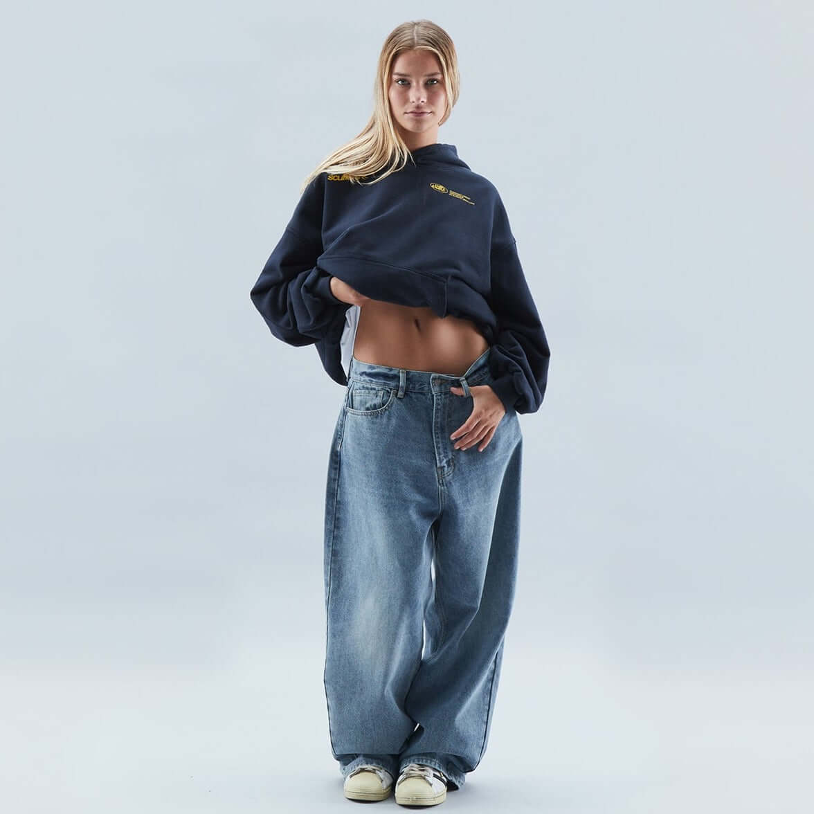 Homixa Avevora women's relaxed hoodie with dropped shoulders, pouch pocket, and ribbed cuffs, shown in a casual fit.