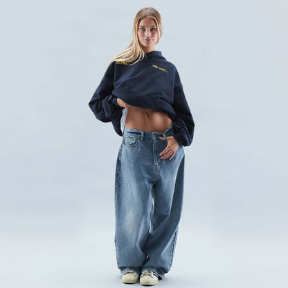 Homixa Avevora women's relaxed hoodie with dropped shoulders, pouch pocket, and ribbed cuffs, shown in a casual fit.