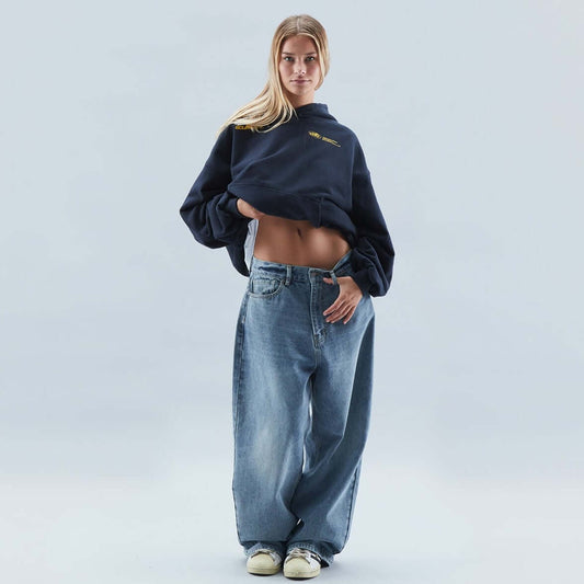 Homixa Avevora women's relaxed hoodie with dropped shoulders, pouch pocket, and ribbed cuffs, shown in a casual fit.