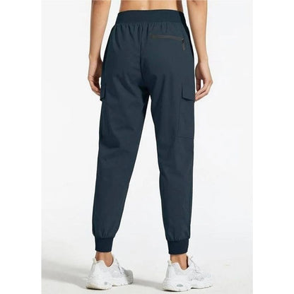 Women's Olive & Evy cargo joggers in lightweight, quick-dry fabric, ideal for hiking, lounging, and casual travel.