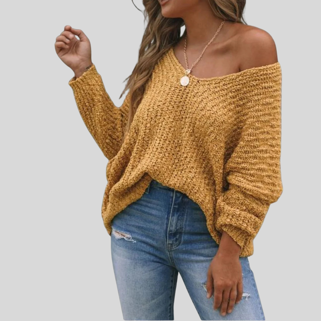 Loppist SOLEDAD™ long sleeve sweater with drop shoulder design, soft knit fabric, and relaxed fit in a cozy, casual style.