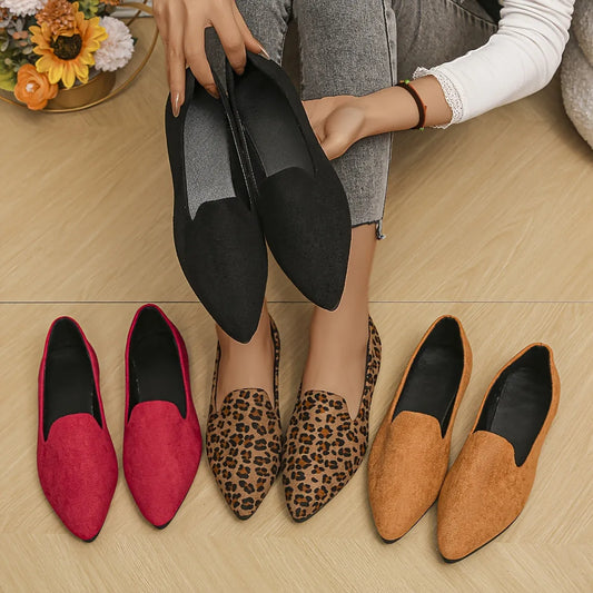Women's slip-on smoking loafers by Homixa with a sleek design and plastic sole, shown in a close-up view.