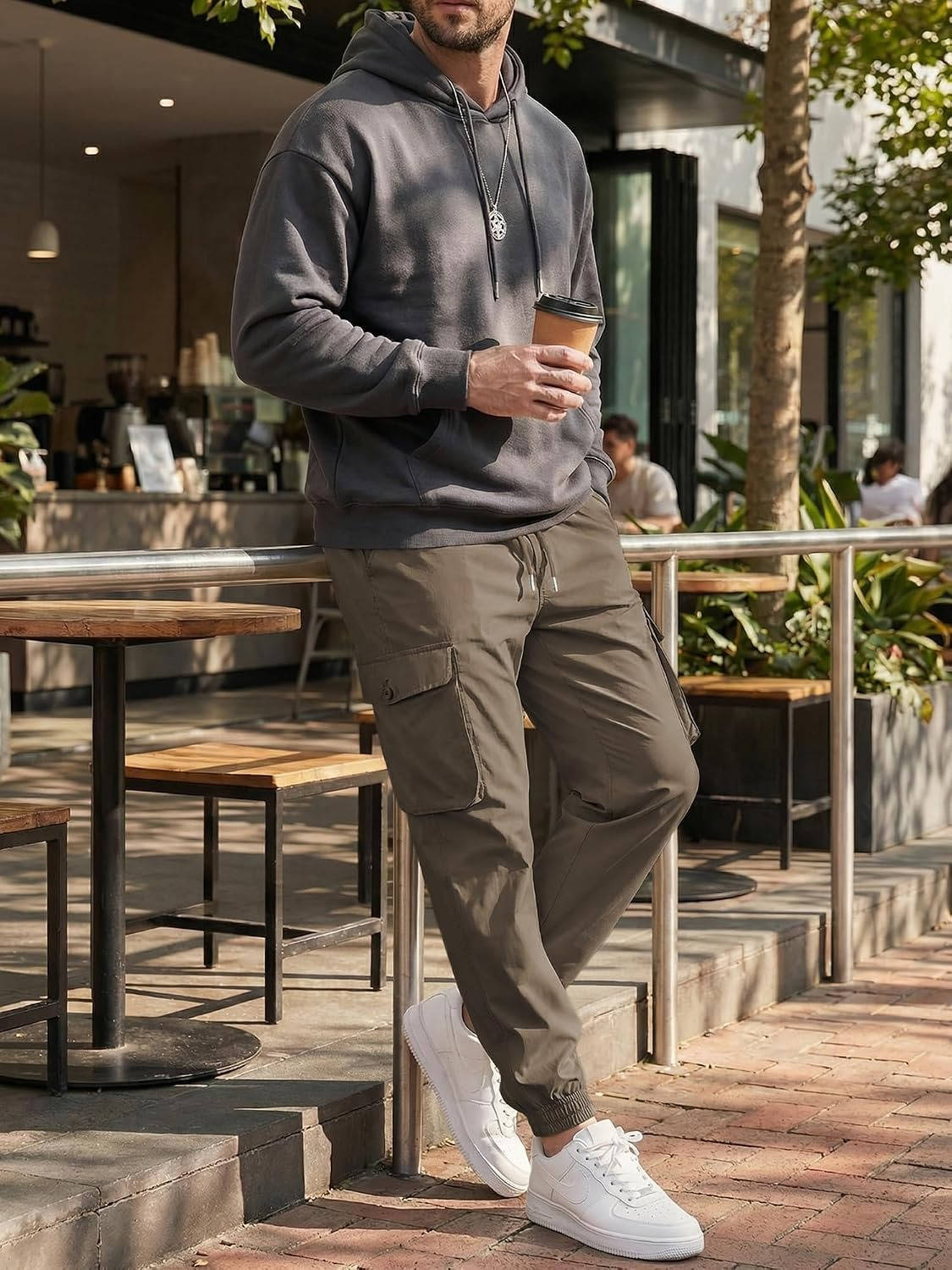 Homixa Belvora men's cargo joggers with drawstring waist, flap pockets, and tapered cuffs, styled for casual comfort.