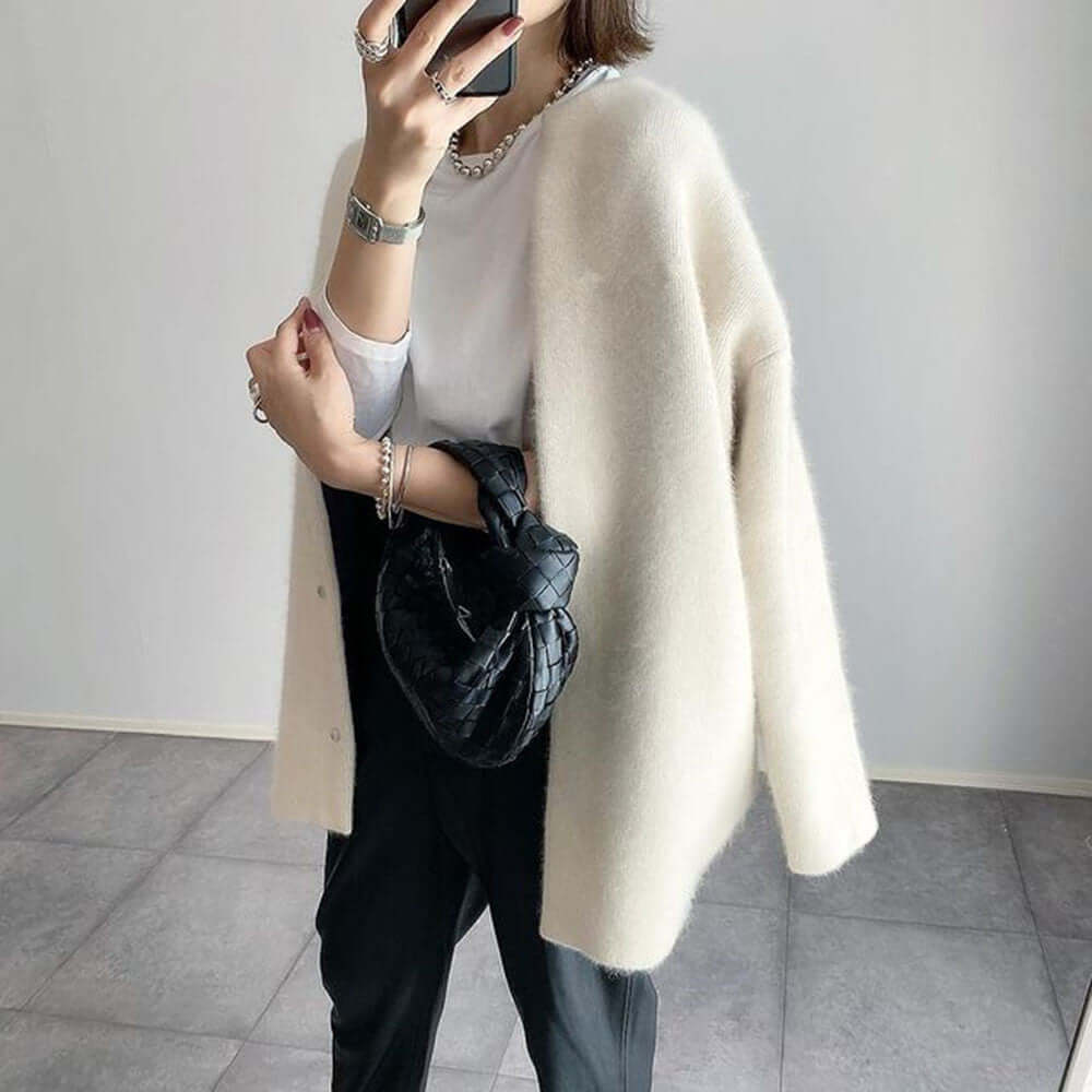 Women's elegant knit cardigan by Lunirel, featuring a cozy, stylish design with a front button closure and long sleeves.
