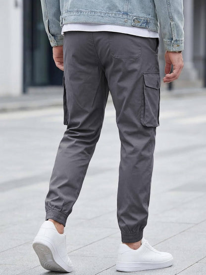 Homixa Belvora men's cargo joggers with drawstring waist, flap pockets, and tapered cuffs, casual athletic pants for men.