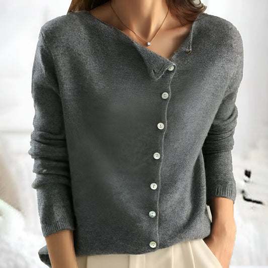 Sarah & Kate Charleston Cashmere Luxury Cardigan, soft beige, lightweight knit, displayed on a hanger with a cozy, elegant look.