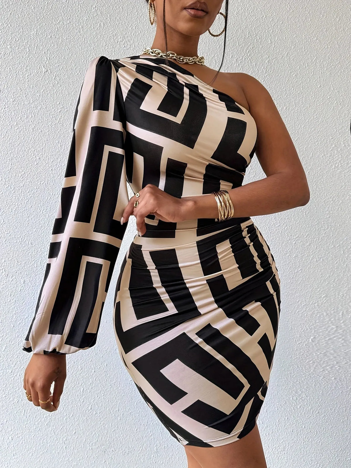 Women's geometric mini dress by Homixa featuring high stretch fabric and a fitted silhouette, showcased in a stylish design.