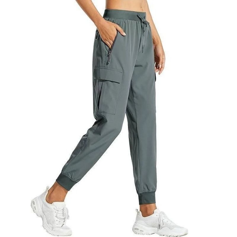 Women’s Olive & Evy cargo joggers featuring lightweight, quick-dry fabric, suitable for hiking, travel, and casual lounging.