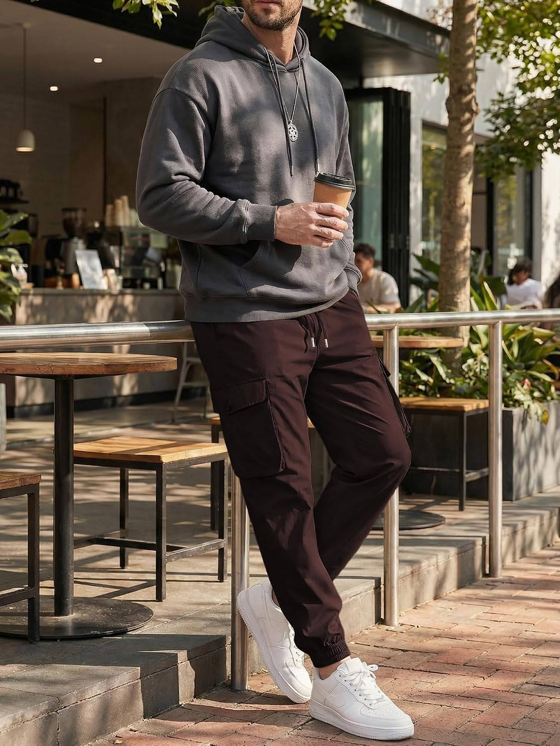 Homixa Belvora men's cargo joggers with drawstring waist, flap pockets, and tapered cuffs, shown in a relaxed fit style.
