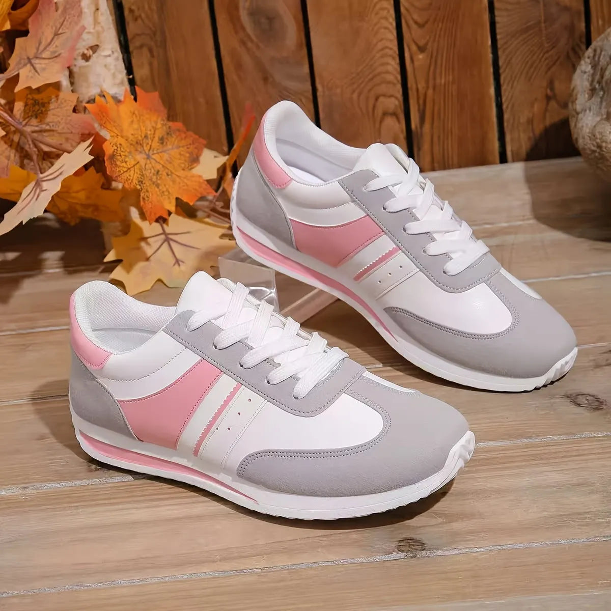 Homixa women's low-top sneakers with geometric pattern lace-up design, casual athletic shoes in black and white.