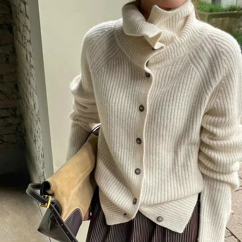 Homixa Alondra women's relaxed soft-knit turtleneck sweater with button details, shown in a cozy, stylish knit design.
