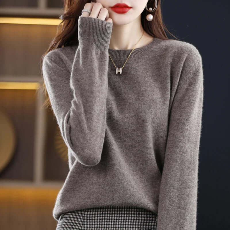 Homixa Belvia women's fine-knit crew-neck sweater with ribbed cuffs and solid color finish, showcasing a comfortable, stylish knit top.
