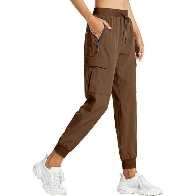 Women's Olive & Evy cargo joggers, lightweight quick-dry hiking and casual travel pants, shown in a relaxed fit style.