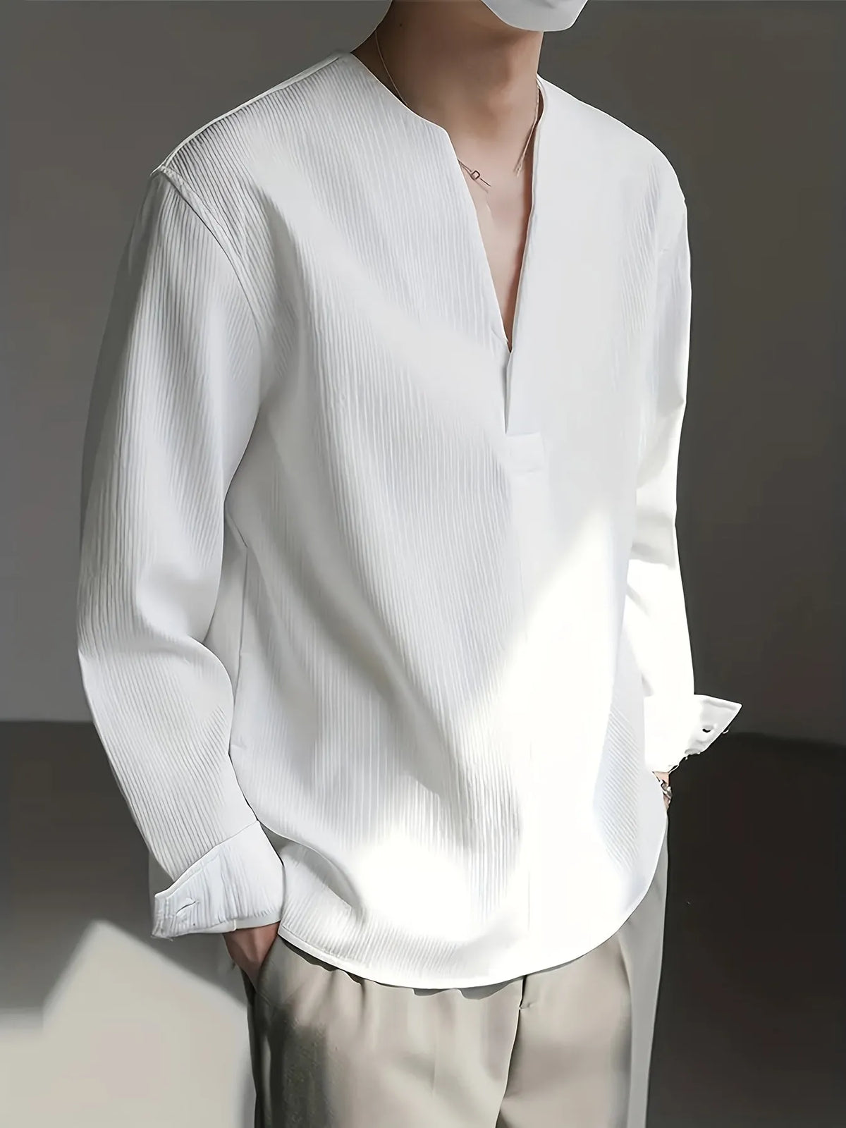 Homixa men's solid color V-neck long sleeve Henley shirt displayed with buttons and a relaxed fit, in a neutral tone.